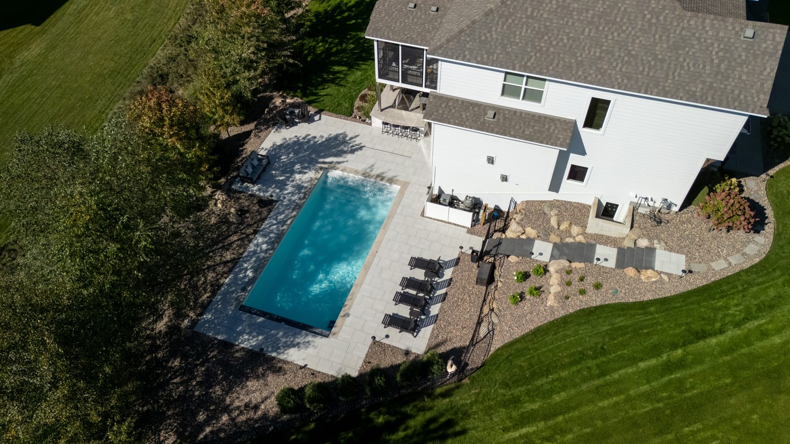 Poolside on the Hill: pool, patio, retaining walls & landscape design in Woodbury, MN, designed and built by Schifsky Companies
