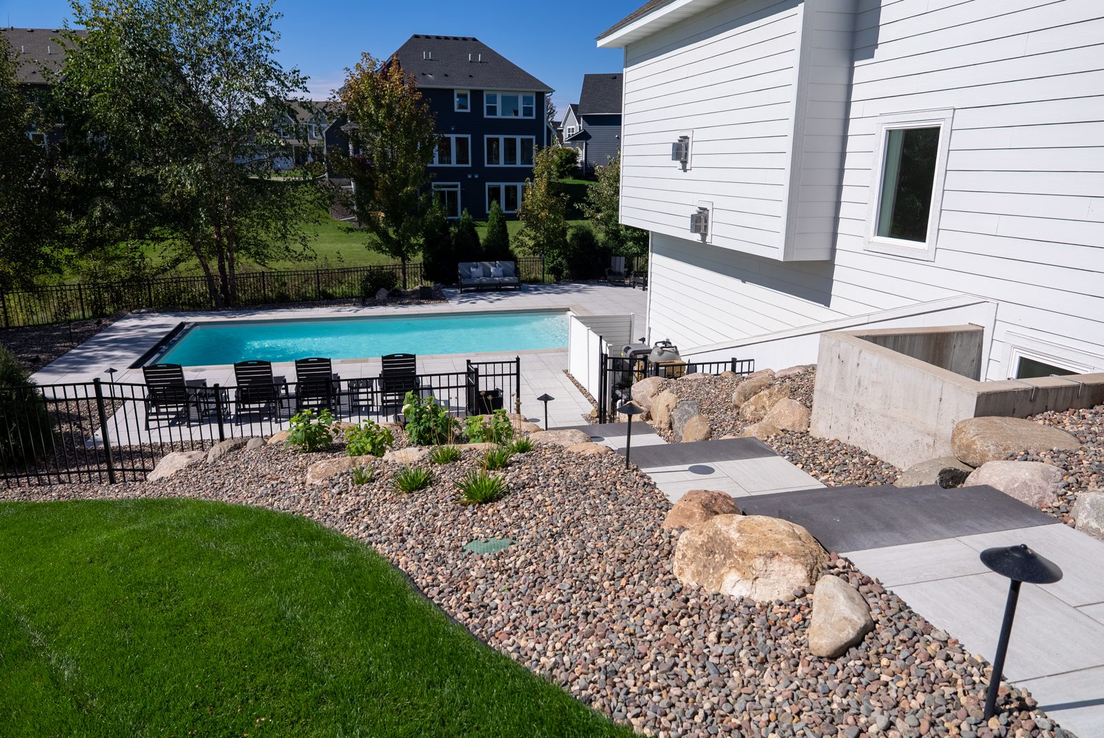 Pool, patio, retaining walls & landscape design in Woodbury, MN: Poolside on the Hill, view 2 of 9