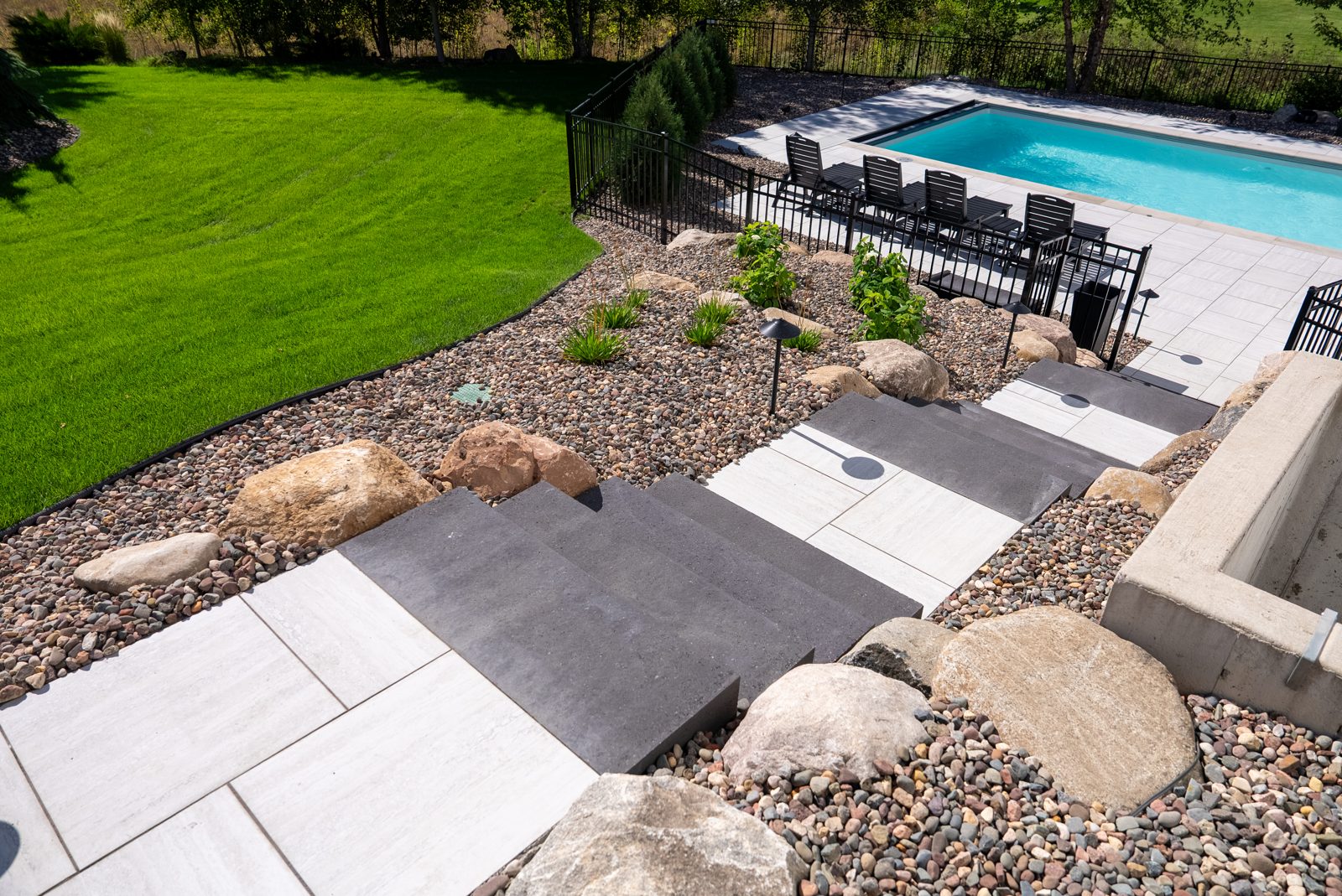 Pool, patio, retaining walls & landscape design in Woodbury, MN: Poolside on the Hill, view 7 of 9