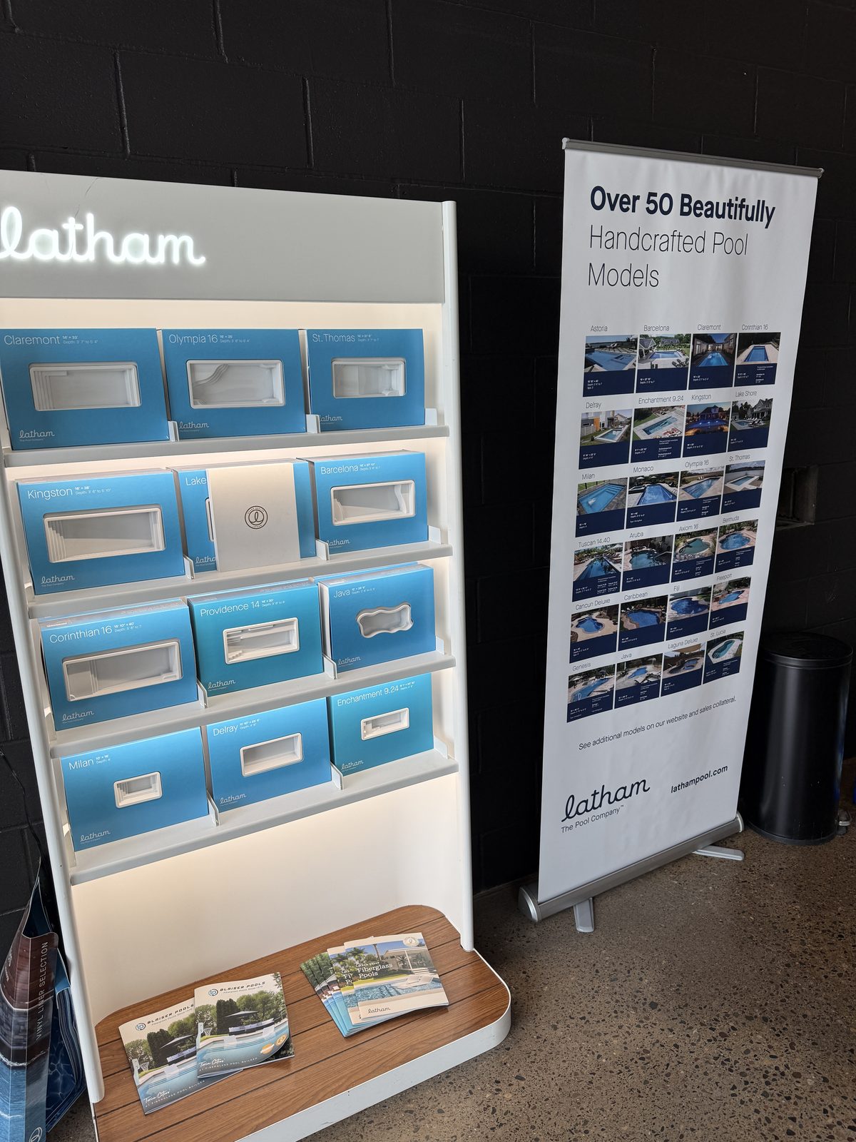 Latham fiberglass pool models display board in the Schifsky Companies showroom